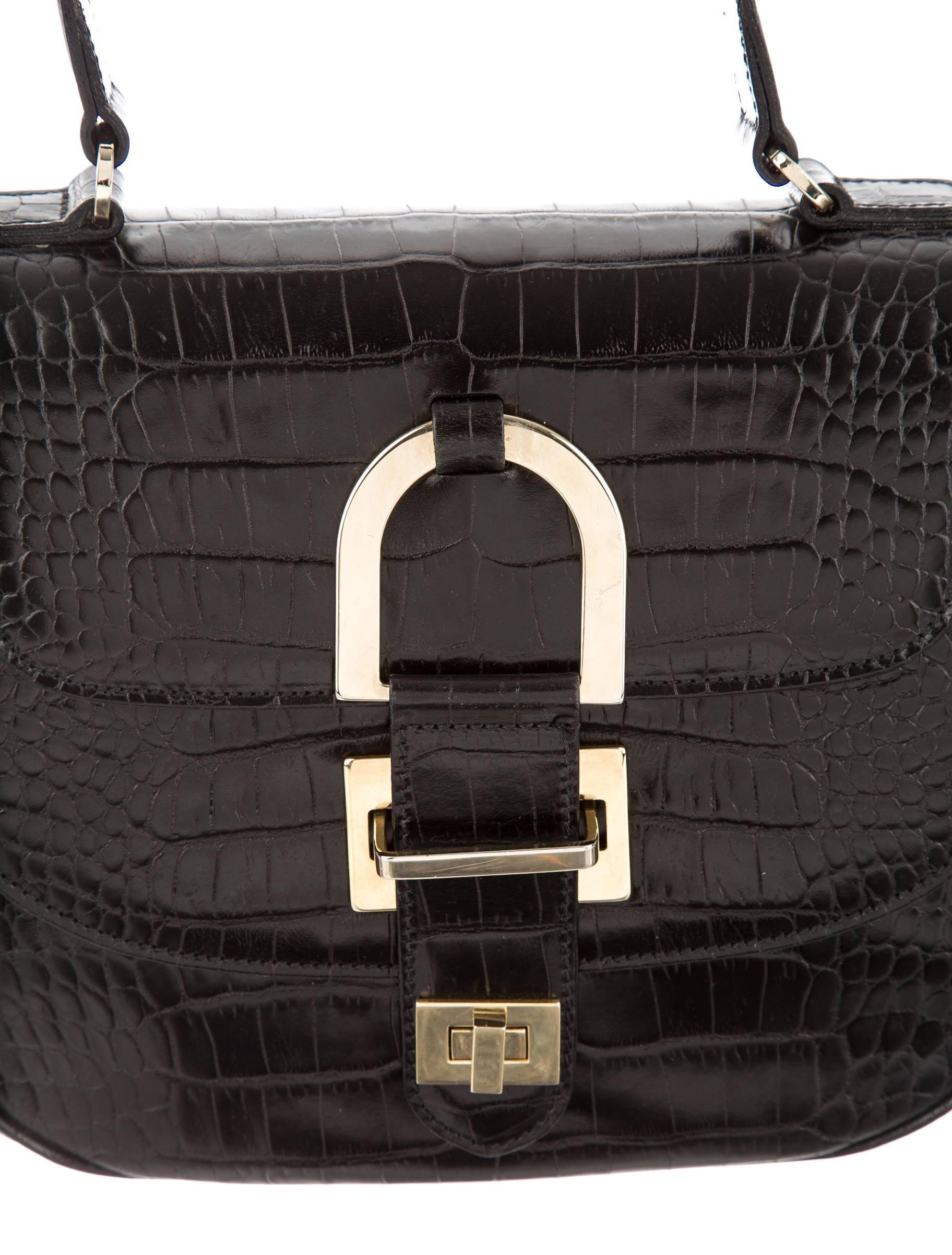 CURATOR'S NOTES

WOW! INCREDIBLE PRICE REDUCTION THIS WEEKEND ONLY!

Own a piece of history with this stunning black alligator top handle satchel bag by the late, great Oscar de la Renta.

Estimated value $20,000
Alligator
Gold