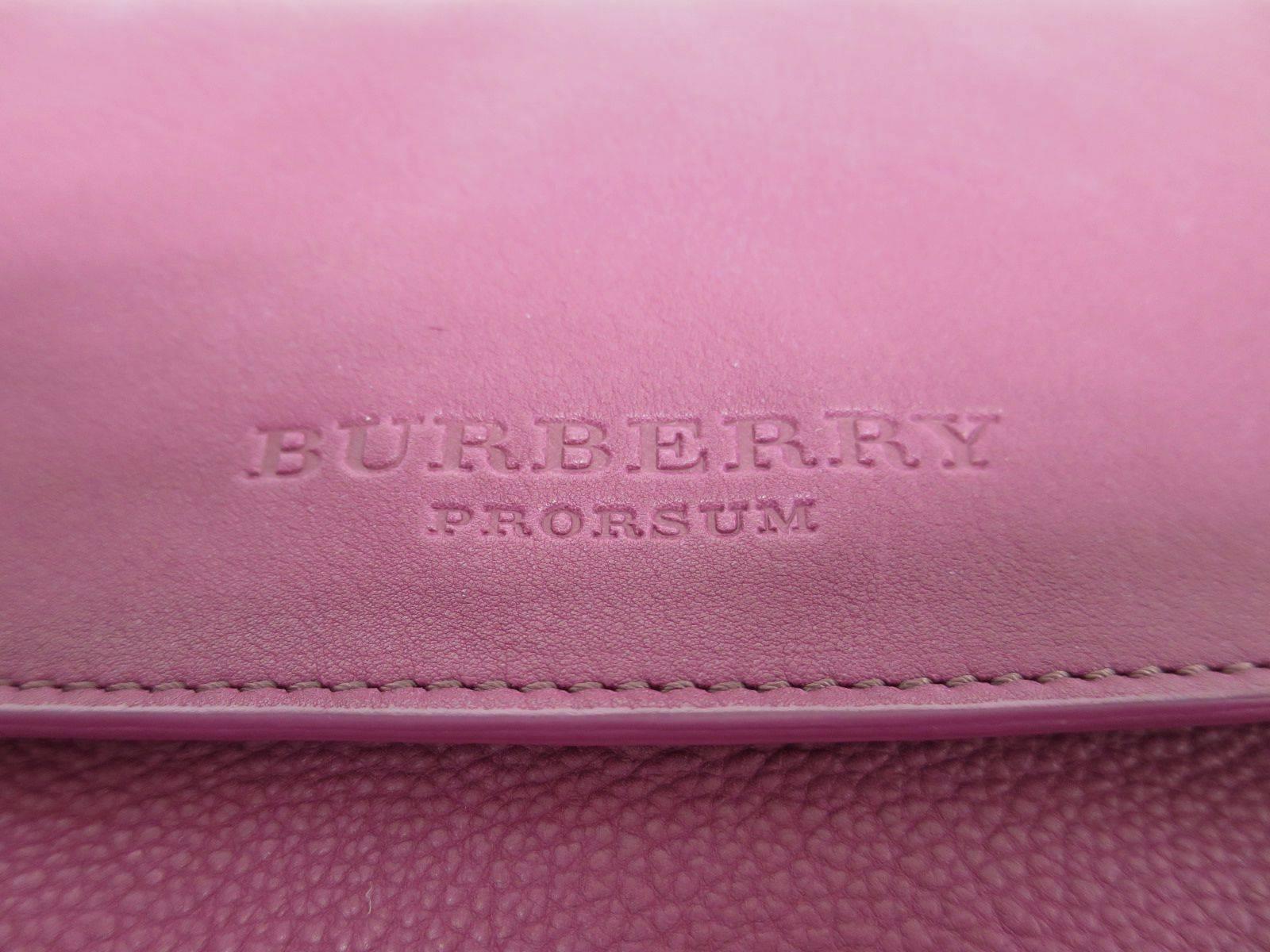 CURATOR'S NOTES

Spice your favorite LBD (little black dress) with a pop of color!  This chic Burberry Prorsum fuchsia leather oversized foldover clutch bag fits the bill.

Leather
Magnet closure
Made in Italy
Measures 14