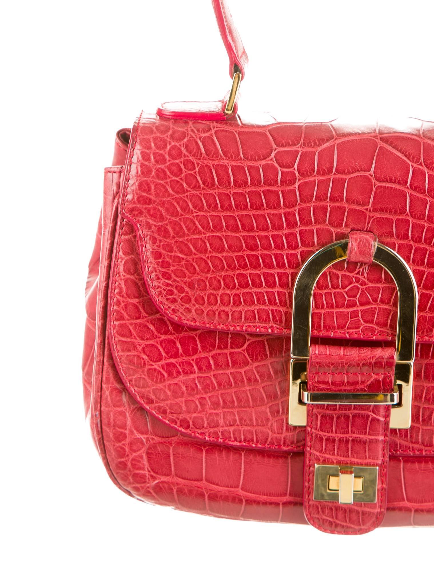 CURATOR'S NOTES  

SPECTACULAR price reduction for a limited time only!

Oscar de la Renta, alligator and luscious red.  Need we say more?  Breathtakingly elegant red alligator top handle satchel bag featuring rich gold hardware by the late,
