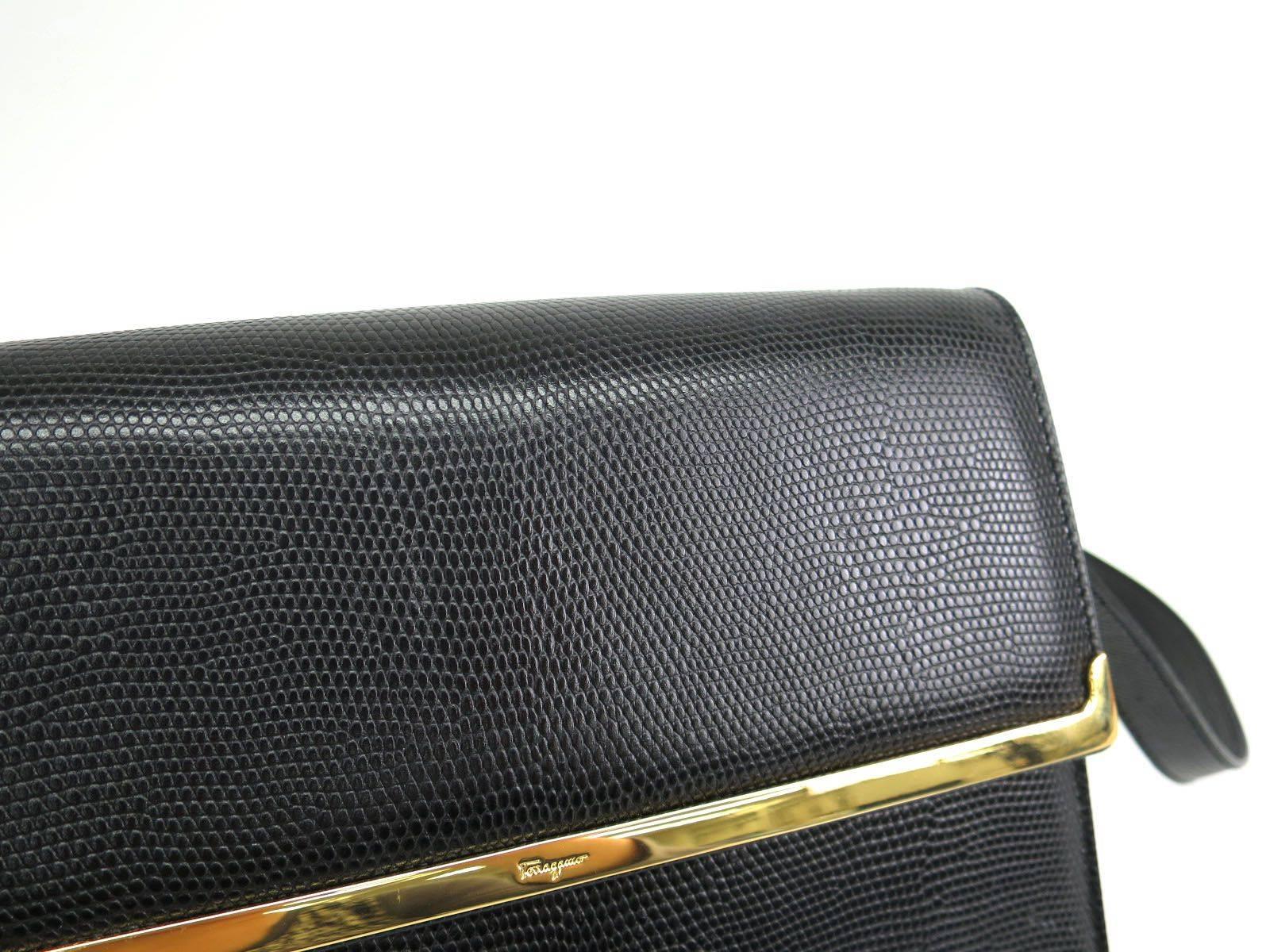 CURATOR'S NOTES

Salvatore Ferragamo Black Leather Flap Gold Hardware Crossbody Shoulder Bag 

Leather
Gold hardware
Magnet closure
Made in Italy
Measures 8.7" W x  6.7" H x 3" D 
Removable and adjustable shoulder strap