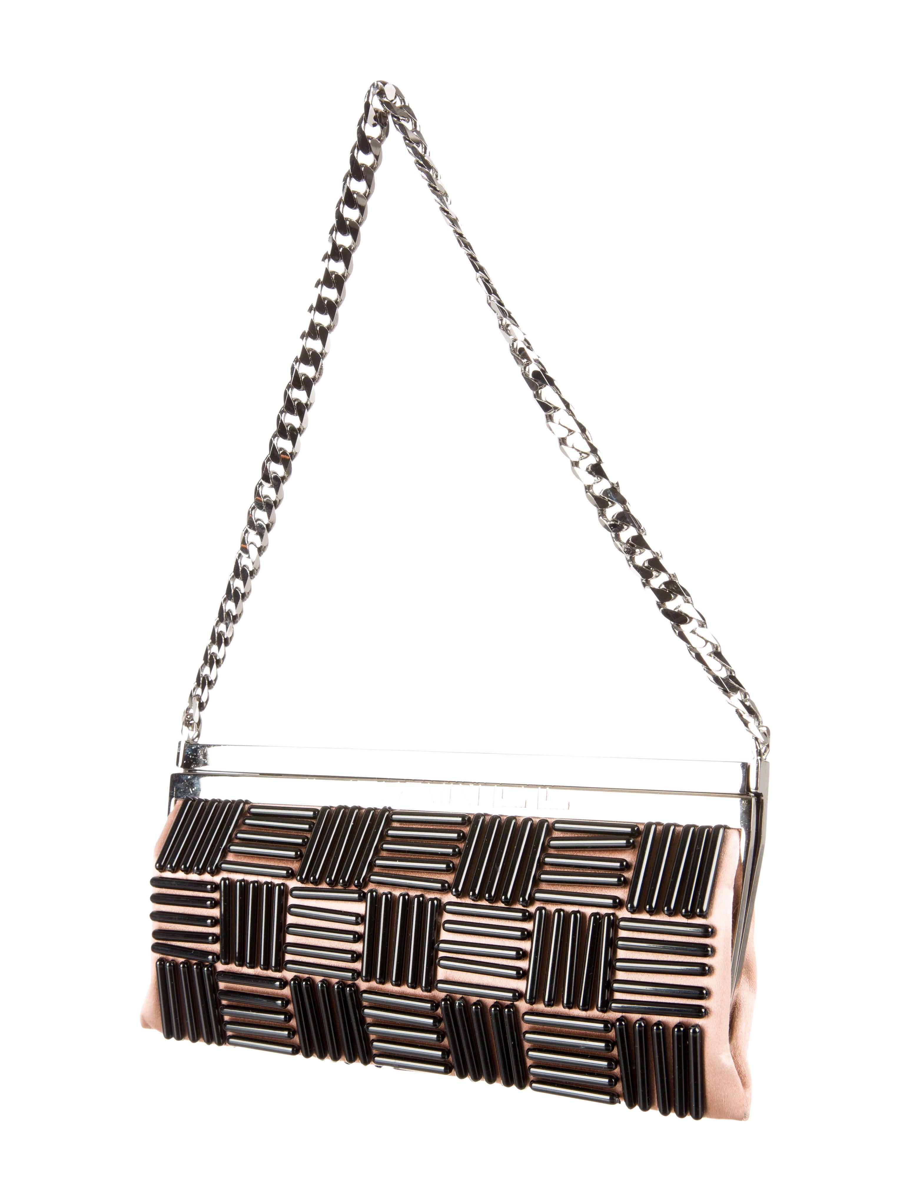 CURATOR'S NOTES

You are sure to dazzle with this satin and bead embellished Chanel bag dangling from your shoulder or wrist. 

Satin
Beads
Gunmetal hardware
Hinged closure
Date code 8888931
Shoulder strap 8.5