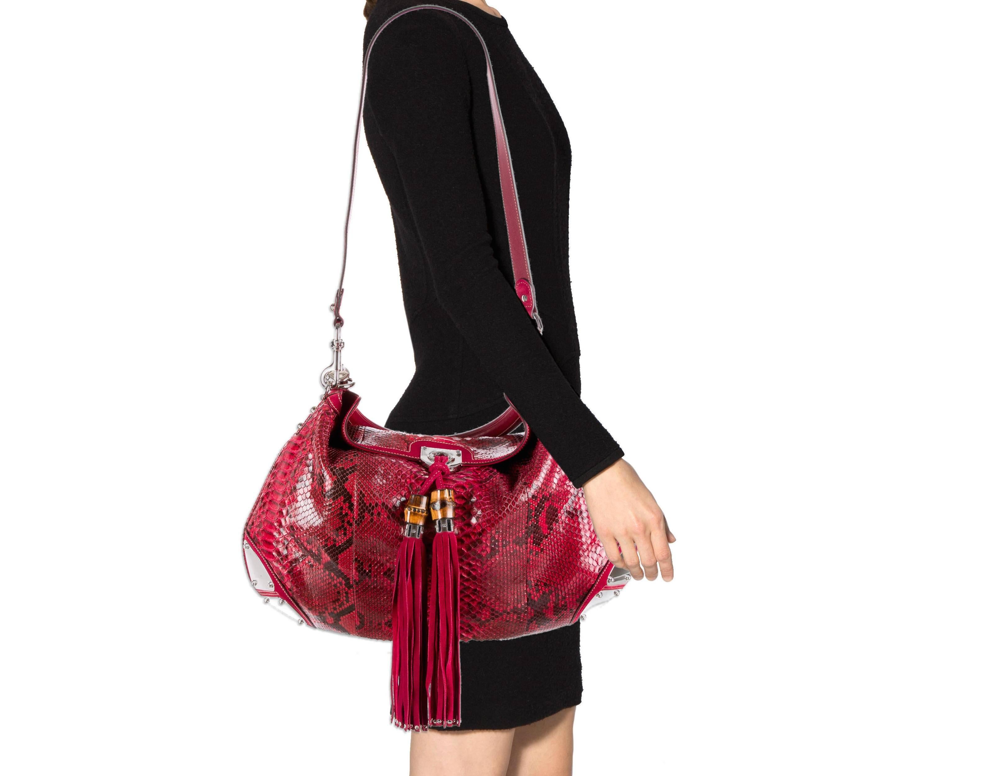 CURATOR'S NOTES

Python 
Leather and suede trim
Silver tone hardware
Fold over flap closure
Leather interior
Bamboo tassels
Removable flat shoulder strap
Handle 3