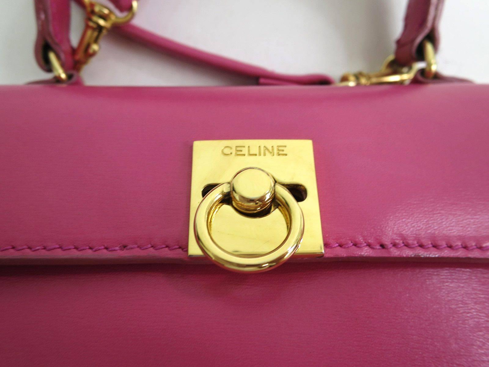 CURATOR'S NOTES

If you missed out on our other Celine box Kelly style satchel bags, do not make the same mistake thrice with this eye popping pink version! Expecting a quick sale on this beauty.

Leather
Gold hardware
Made in Italy
Measures