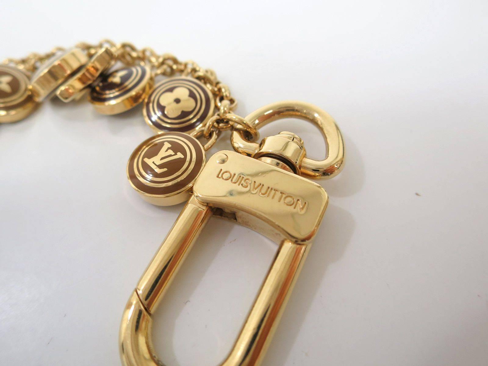 Louis Vuitton Gold Tone Logo Lock Key Bag Charm Chain In Good Condition In Chicago, IL