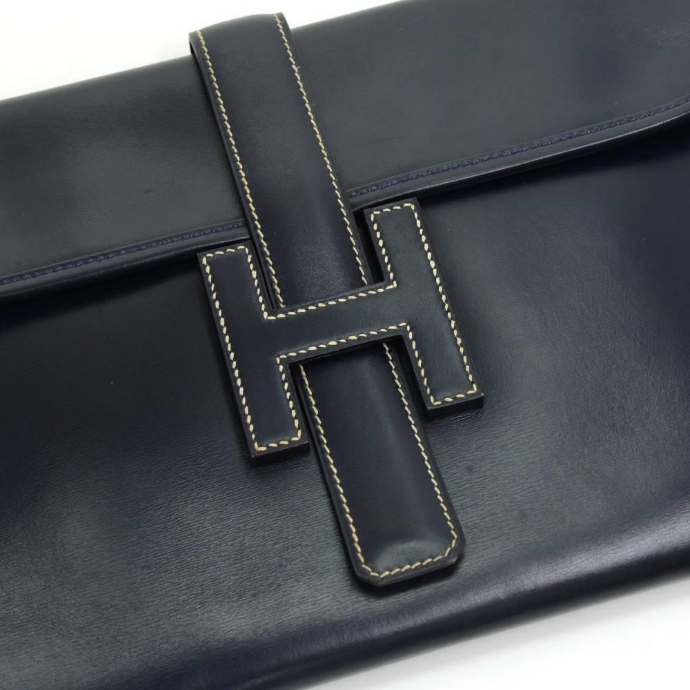 CURATOR'S NOTES

The ultimate statement clutch: The Hermes Jige 'H' clutch in timeless navy blue accented with tan stitching that outlines the classic Hermes 'H'.  You will not find this gem better priced.

Leather
Toile lining
Made in