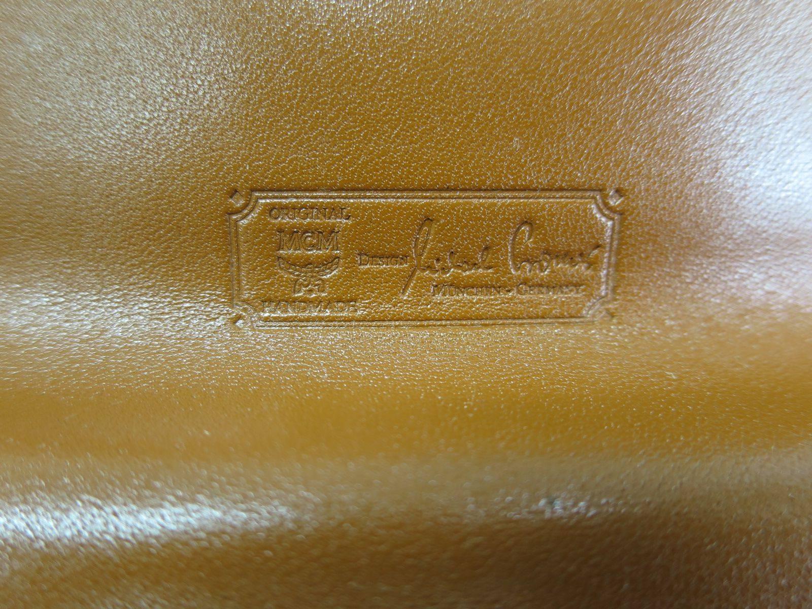 MCM Cognac Braun Monogrammierte Kelly Top Handle Satchel Tasche mit Goldbeschlägen Damen