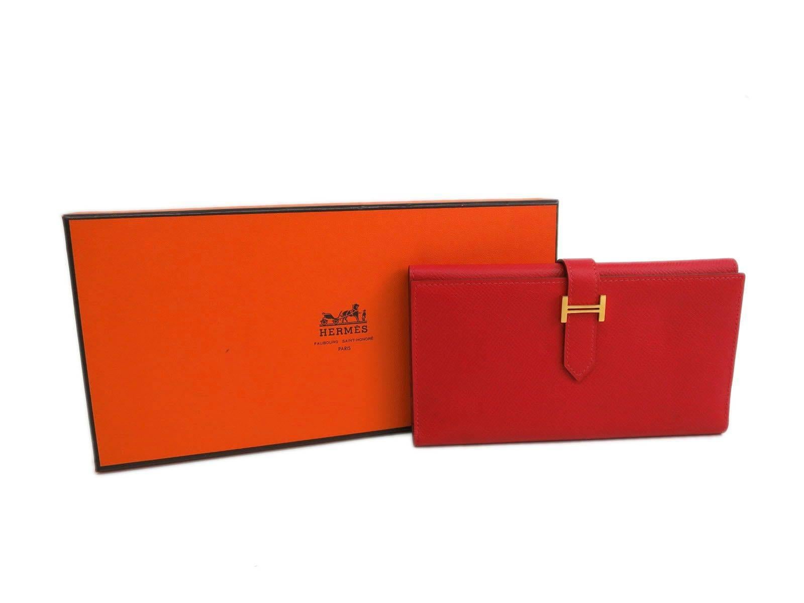 CURATOR'S NOTES

The ultimate accessory!  Stunning red Hermes Bearn 'H' wallet in the original Hermes box.  Priced to sell.

Retail price $2,650
Epsom leather
Gold hardware
Belt closure
Made in France
Date code Square O (2011) 
Measures