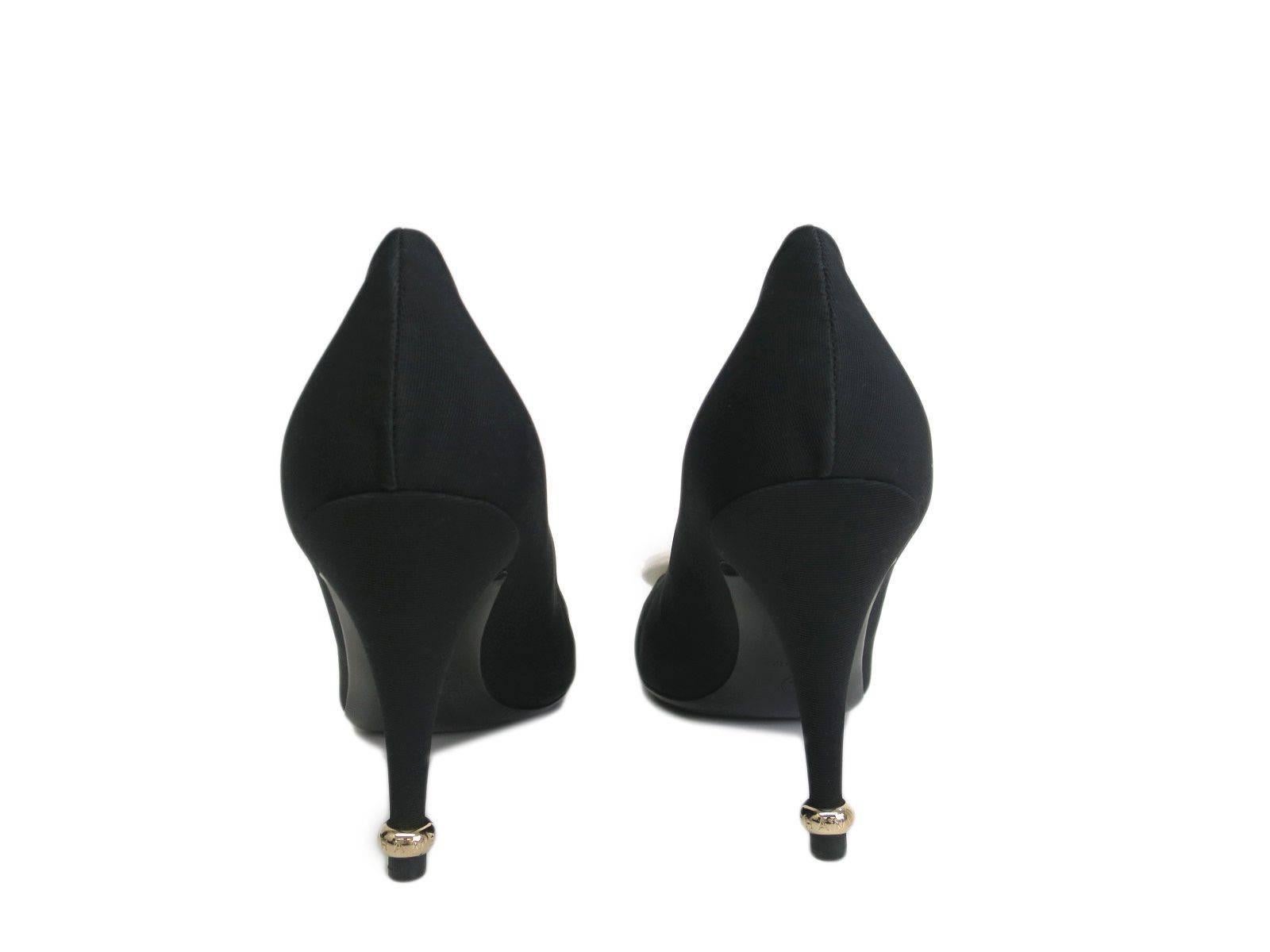CURATOR'S NOTES

Size listed IT38
Fabric
Gold hardware
Heel height 3.5