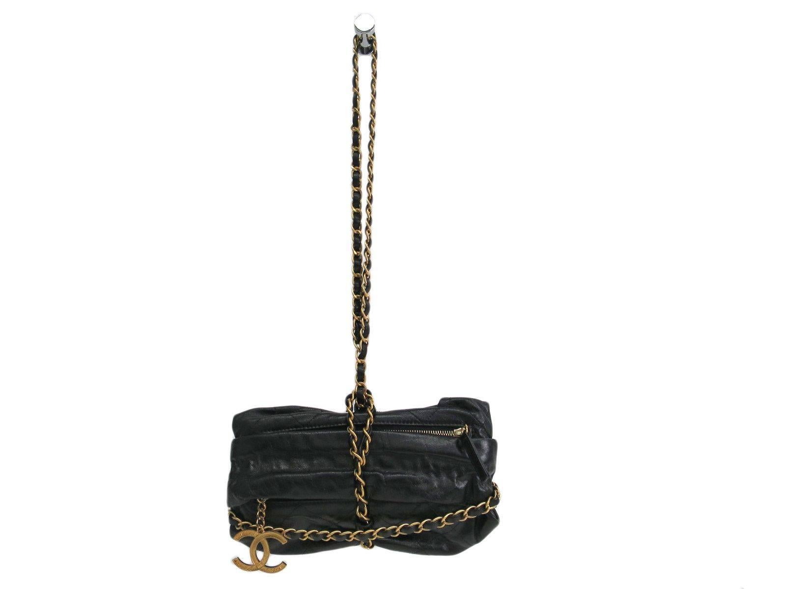 CURATOR'S NOTES

Highly sought and hard to find Chanel Baluchon clutch shoulder bag.  Featuring buttery calfskin leather, rich gold CC charm and chain, you will not find this beautiful bag anywhere at this incredible price.

Calfskin