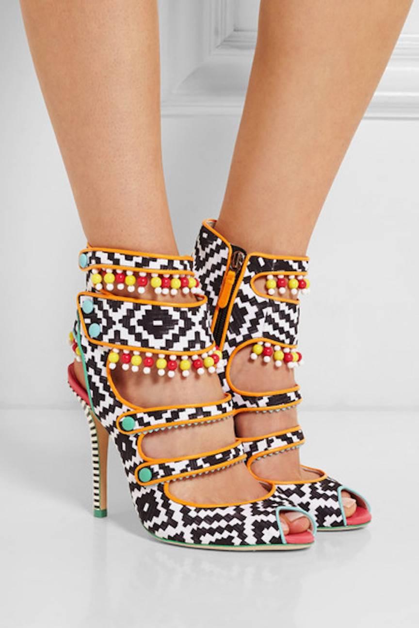 CURATOR'S NOTES

Chic, brand NEW and SOLD OUT Sophia Webster printed sandals featuring beaded embellishments, zip closures at sides and striped resin covered heels. 

Includes original Sophia Webster dust bag and box.

Size IT 37 (US