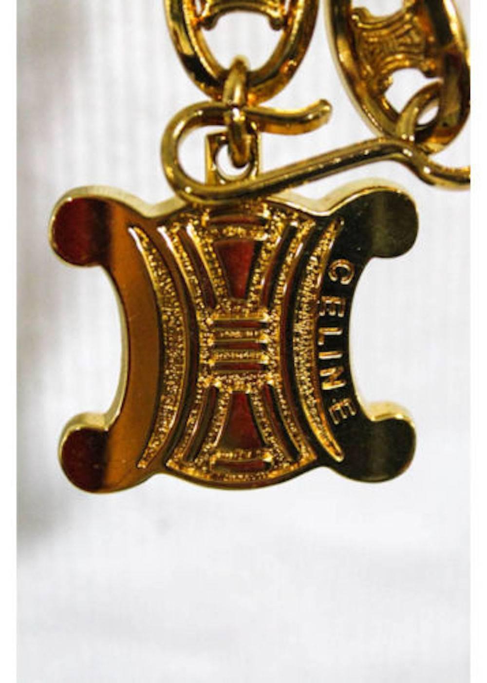 Celine Vintage Gold Logo Chain Link Charm Waist Belt 

Gold tone
Metal
Hook closure
Width 0.5