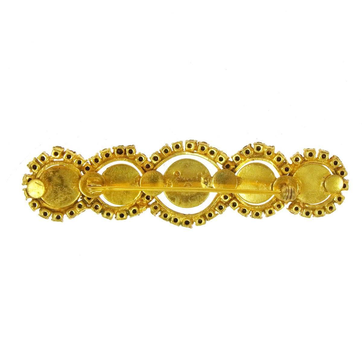 CURATOR'S NOTES

Metal
Gold tone hardware
Faux pearl
Rhinestone
Pin closure
Made in France
Width 1