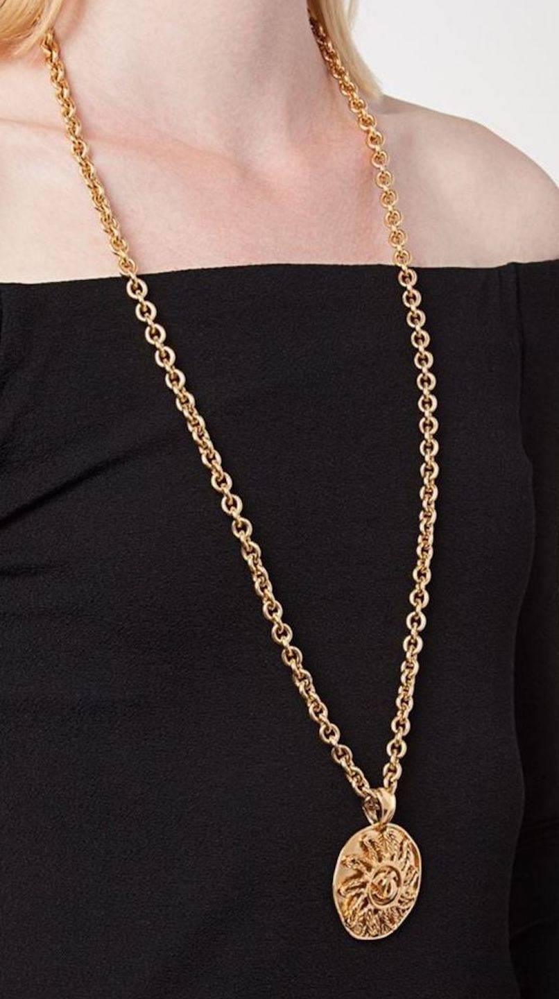 Chanel Vintage Gold Textured Sun Charm Coin Link Long Drape Necklace in Box

Metal
Gold tone
Lobster claw closure
Made in France
Charm diameter ~2