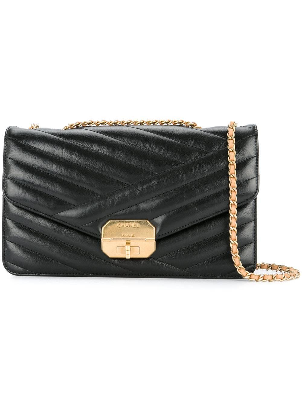 Chanel Black Chevron Lambskin Flap Bag With Accessories

Lambskin
Gold tone hardware
Turnlock closure
Twill lining
Measures 10