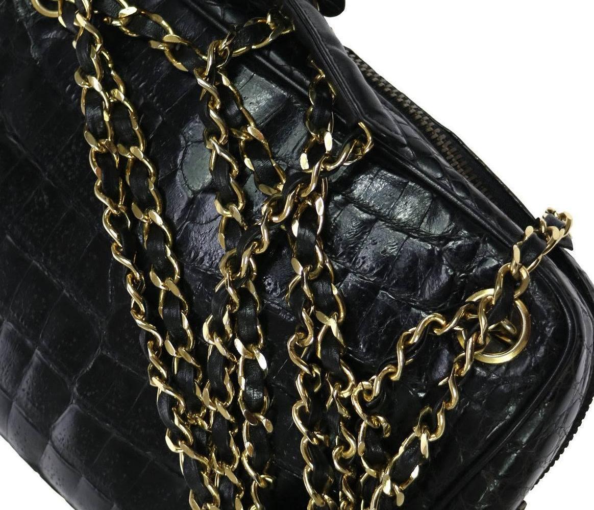 CURATOR'S NOTES

Crocodile
Gold tone hardware
Zipper closure
Made in Italy
Date code 0646209
Shoulder strap drop 16"
Measures 8.75" W x 6" H x 3" D 
Includes original Chanel dust bag
