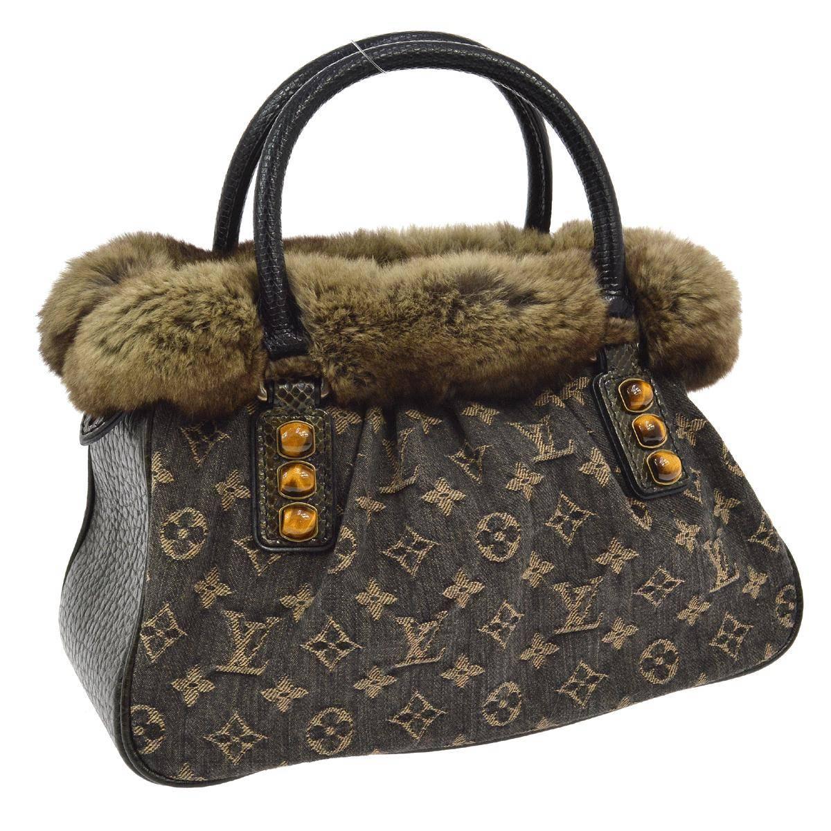 CURATOR'S NOTES

Louis Vuitton Limited Edition Brown Monogram Fur Top Handle Evening Satchel Bag 

Monogram fabric
Fur
Lizard trim
Tiger's eye cabochon stones
Satin lining
Made in France
Date code AS 0075
Handle drop 4"
Measures 12.5" W x