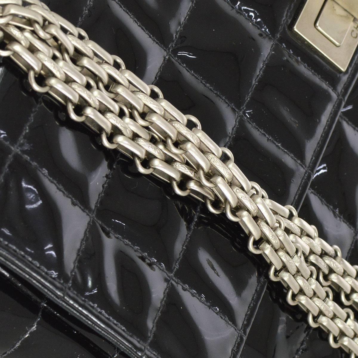 CURATOR'S NOTES

Chanel 2.55 Black Patent Leather Quilted Silver Chain Evening Shoulder Flap Bag  

Patent leather
Silver tone hardware
Turnlock closure
Date code 6060881
Made in France
Single shoulder strap drop 21"
Double strap drop