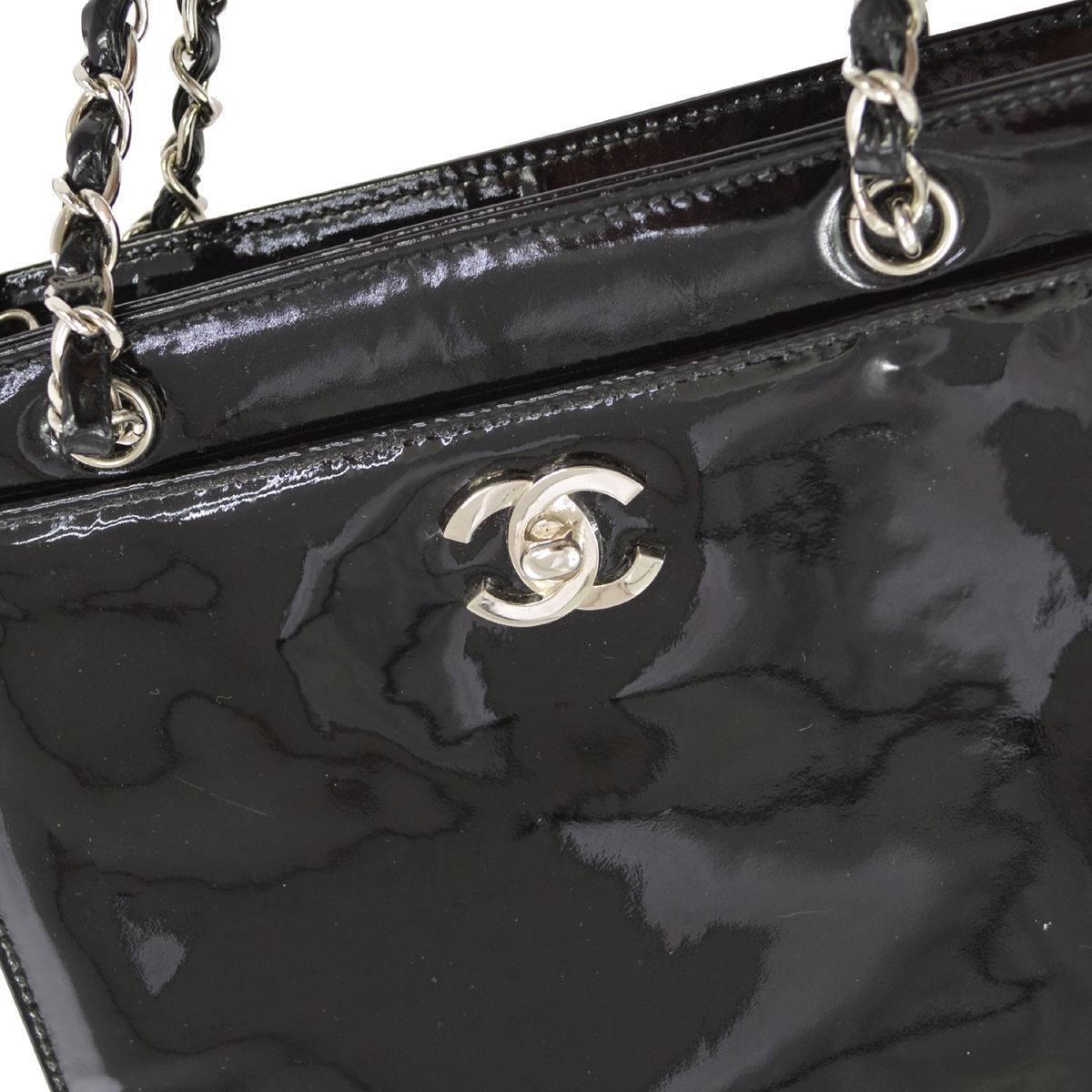 Chanel Black Patent Leather Small Shopper Evening Top Handle Bag 

Patent
Silver tone hardware
Zipper closure
Leather lining
Made in France
Date code 5024232
Strap drop 9