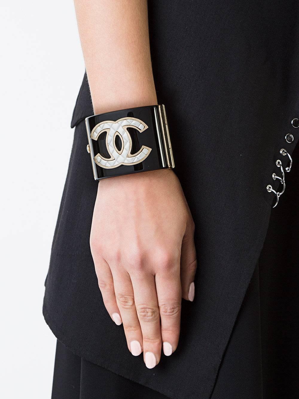 LOWEST PRICE REDUCTION! Chanel Black Gold Quilted Charm Statement Evening Cuff Bangle Bracelet 

Plastic
Metal
Gold tone
Push hinge closure
Made in Italy
Width 2