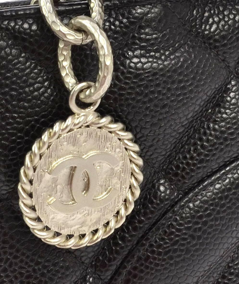 Chanel Black Caviar Leather Silver Medallion Charm Classic Top Handle Tote Bag

Caviar leather 
Silver tone hardware 
Zipper closure 
Date code present 
Made in France 
Strap drop 7