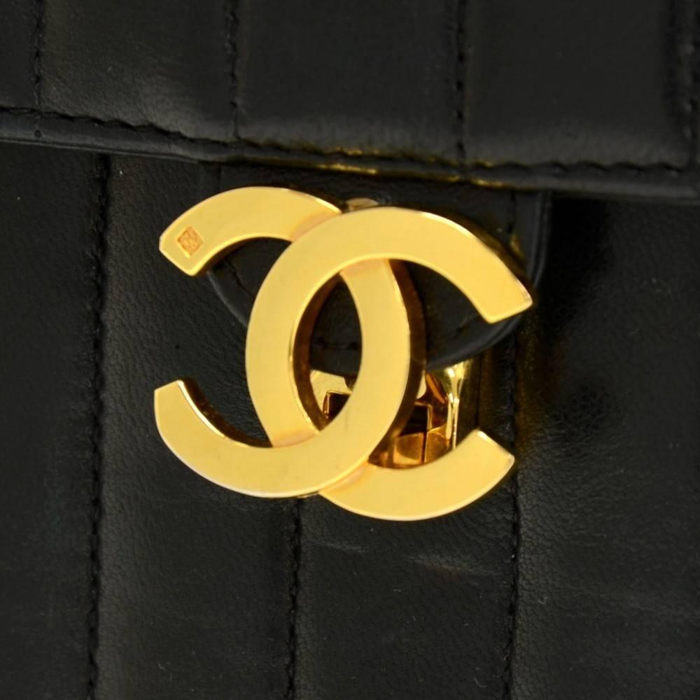 Chanel Vintage Black Lambskin Top Handle Satchel Evening Bag  

Lambskin leather
Gold tone hardware
Turnlock closure
Leather lining
Made in France
Handle drop 4
