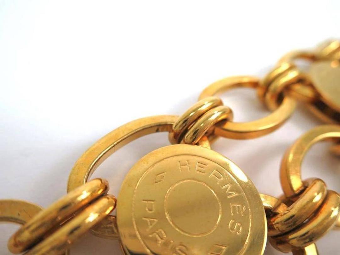 Hermes Gold Sellier 'HERMES PARIS' Medallion Coin Chain Link Cuff Charm Bracelet In Good Condition In Chicago, IL
