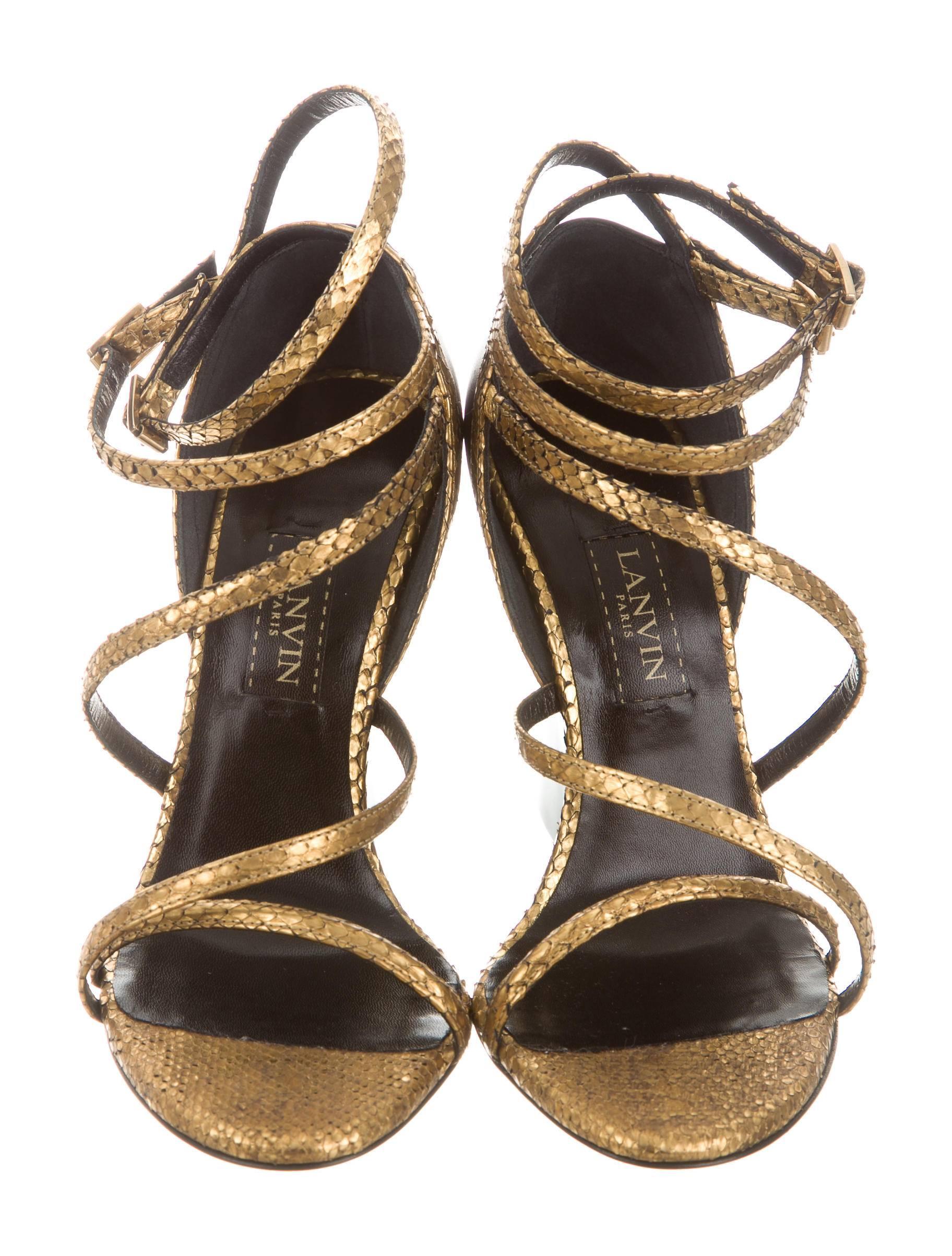 CURATOR'S NOTES

Lanvin New Gold Snake Brown Leather Wedge Strappy Sandals Heels  

Size IT 36.5
Snakeskin
Leather
Ankle buckle closure
Made in Italy 
Heel height 3.75"
Includes original Lanvin dust bag