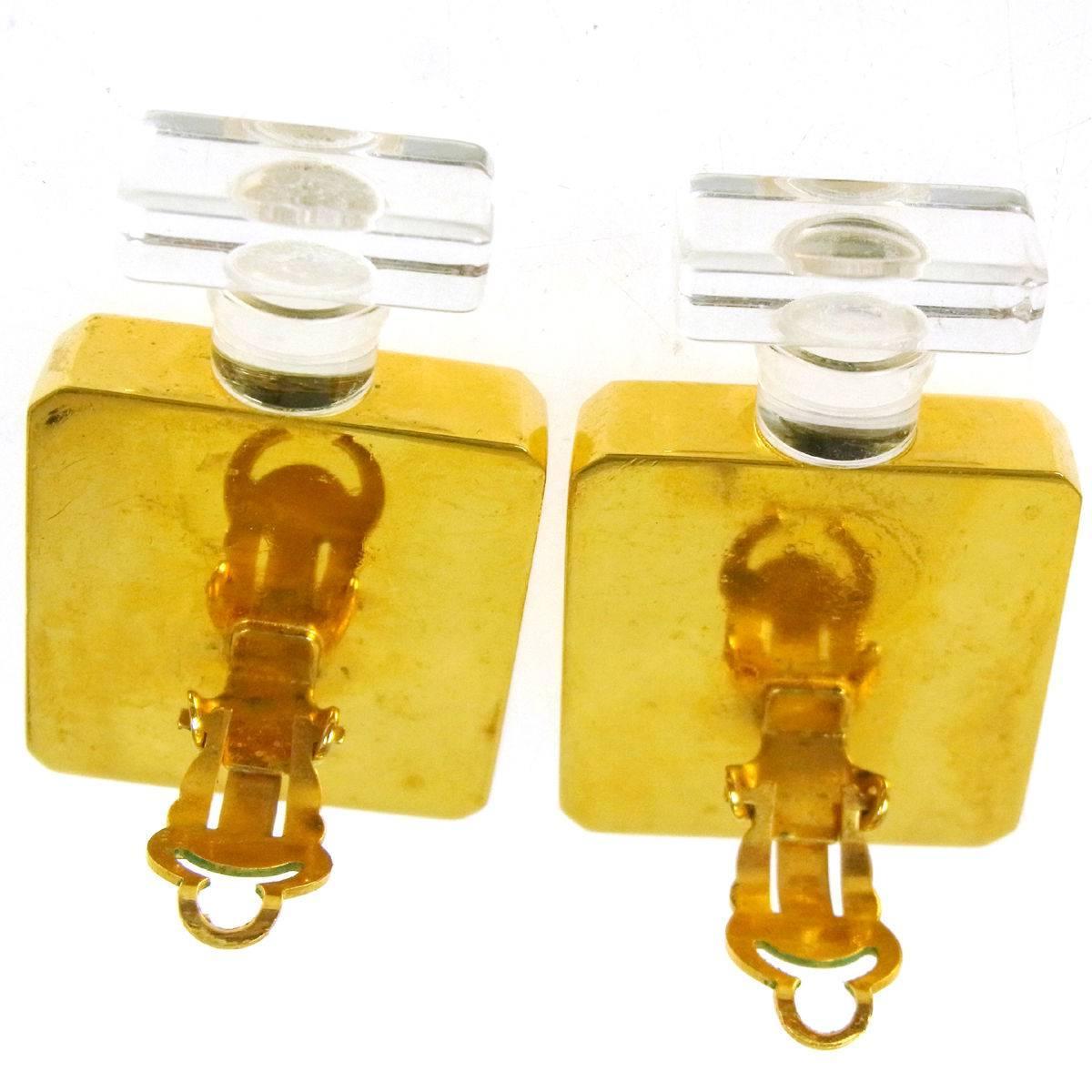 Chanel Rare Vintage Gold Chanel No 5 Bottle Evening Earrings  
Metal
Gold tone
Clip on closure 
Width 1