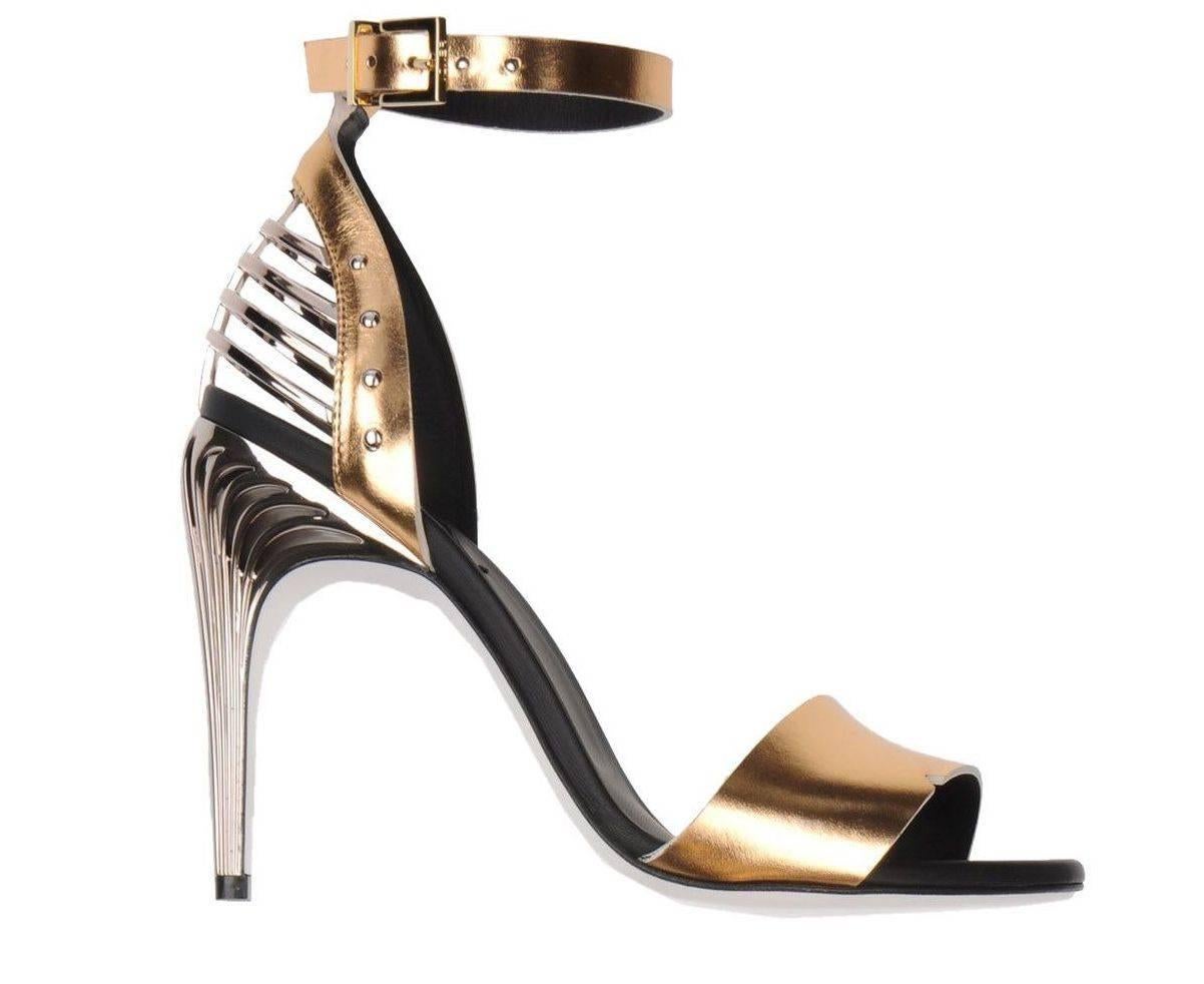 CURATOR'S NOTES

LAST PAIR!  Fendi New Sold Out Gold Silver Metallic Leather Sandals Heels in Box  

Size IT 36
Leather
Ankle strap closure
Made in Italy
Heel height 4.25
