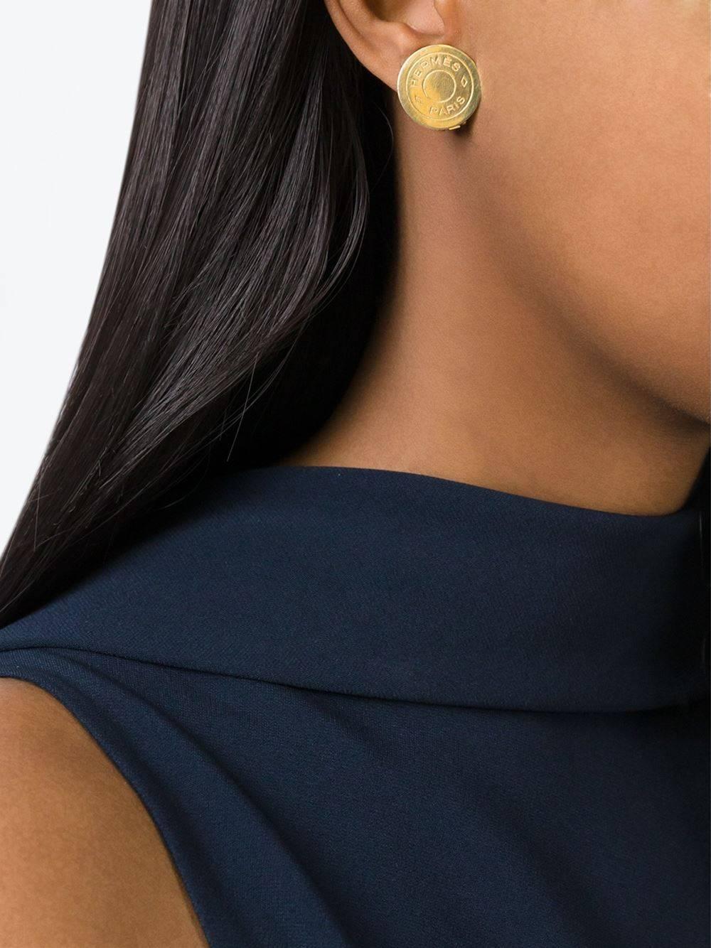 Hermes Gold Round Coin 'HERMES PARIS' Charm Evening Stud Earrings  

Metal
Gold tone
Clip on closure
Signed
Diameter ~1