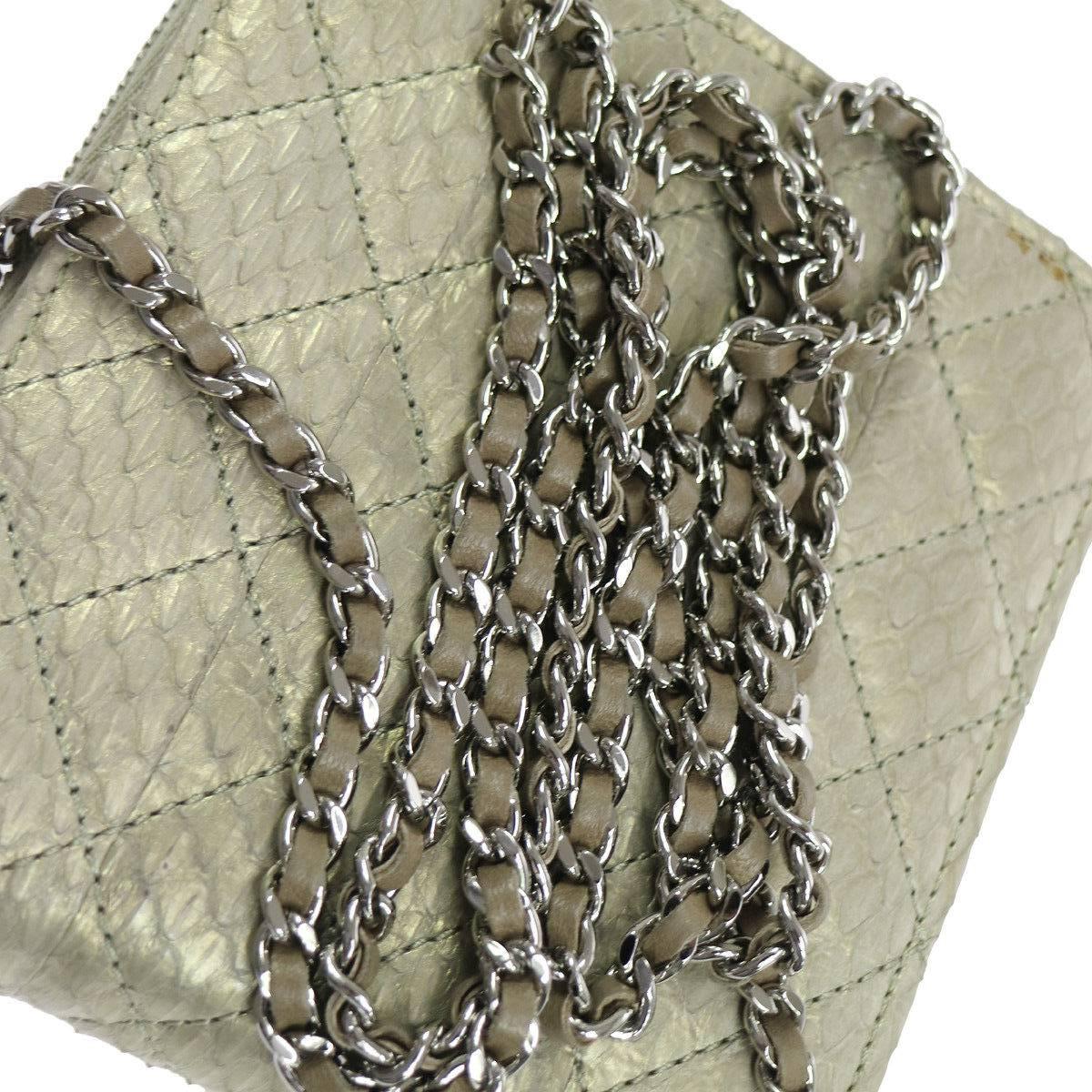 Chanel Python Metallic Iridescent Evening Wallet on Chain WOC Crossbody Shoulder Flap Bag

Python
Leather 
Silver tone hardware
Turnlock closure
Leather lining
Made in Italy
Date code present
Shoulder strap drop 27"
Measures 5.5" W x