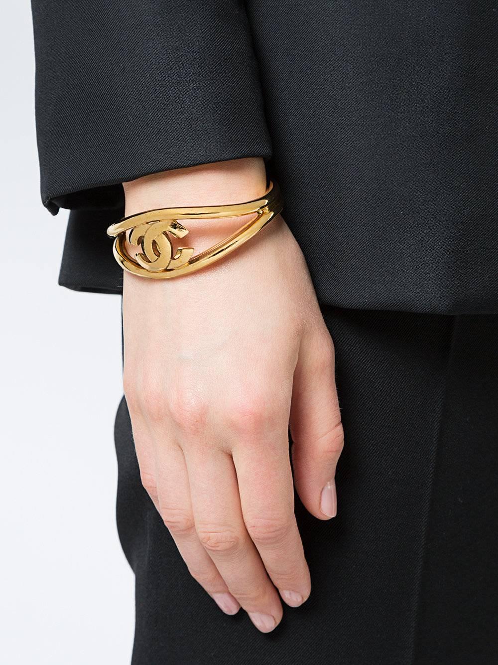 Chanel Gold CC Logo Open Adjustable Evening  Bangle Cuff Bracelet

Metal
Gold tone
Slip on closure
Made in France
Width 1.5