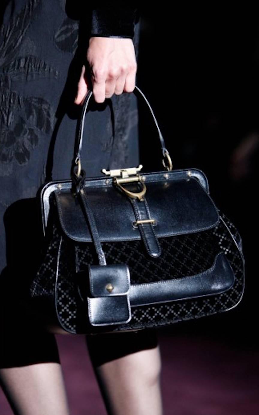 CURATOR'S NOTES

Gucci Runway Black Leather Kelly Style Evening Top Handle Satchel Doctor Flap Bag

Leather
Velvet 
Gold tone hardware 
Woven lining
Pull-through and push lock closures 
Made in Italy
Handle drop 5"
Measures 12.5" W x