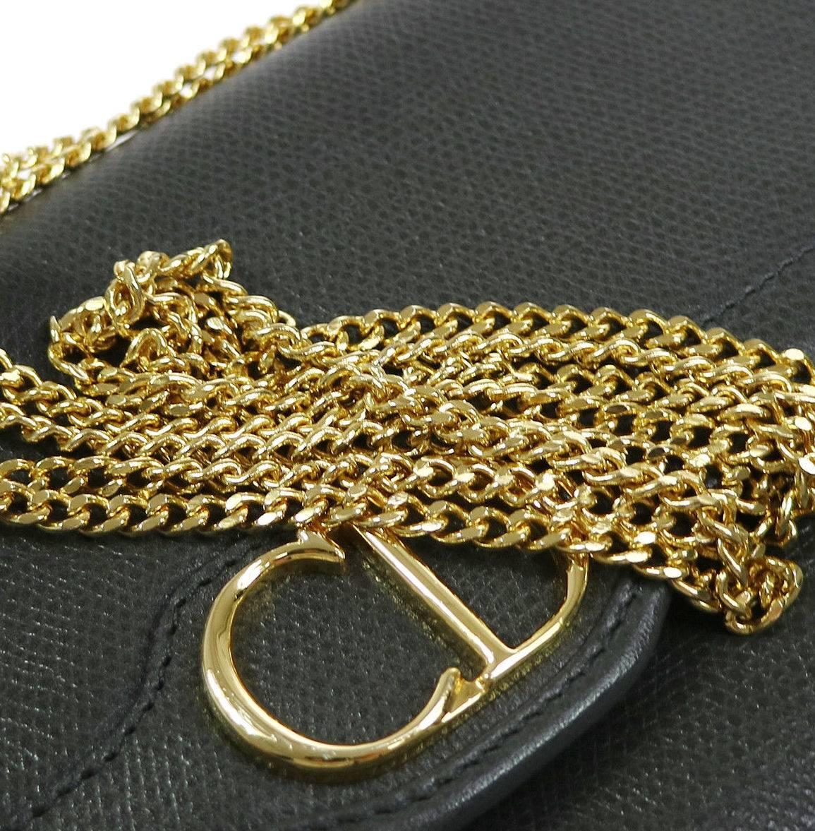 Christian Dior 'CD" Charm Gold Leather 2 in 1 Clutch Shoulder Flap Bag

Leather
Gold hardware
Woven lining
Made in France
Shoulder single strap drop  21.5" 
Shoulder double strap drop 11.75"
Measures 8.25" W x 6.25" H x