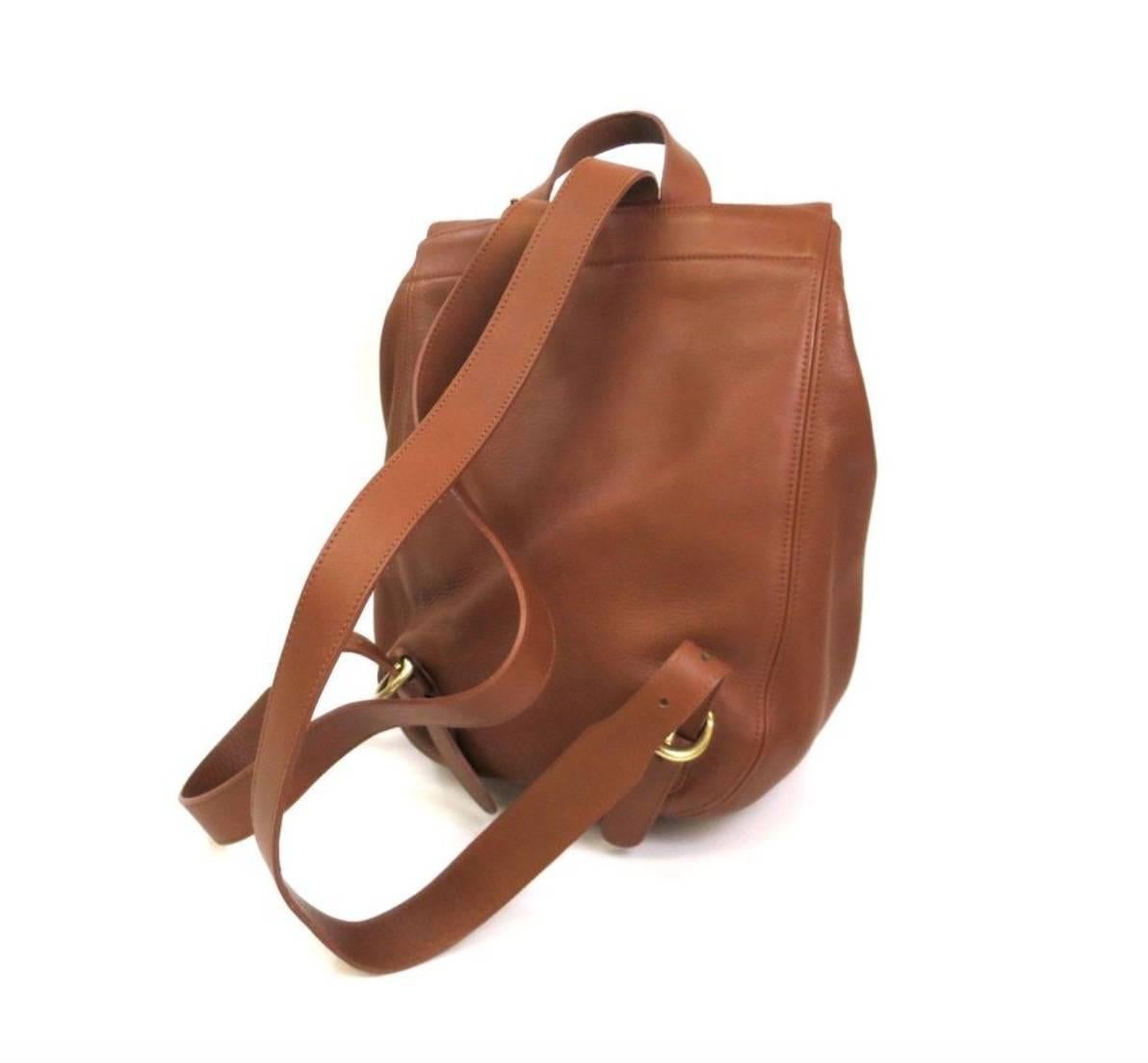 Coach Vintage Archive Classic Cognac Leather Top Handle Satchel Backpack Flap Bag

Leather
Gold tone hardware
Buckle closure 
Made in United States 
Adjustable straps measure 25.5-28.25"
Measures 13.25" W x 12" H x 6.25" D