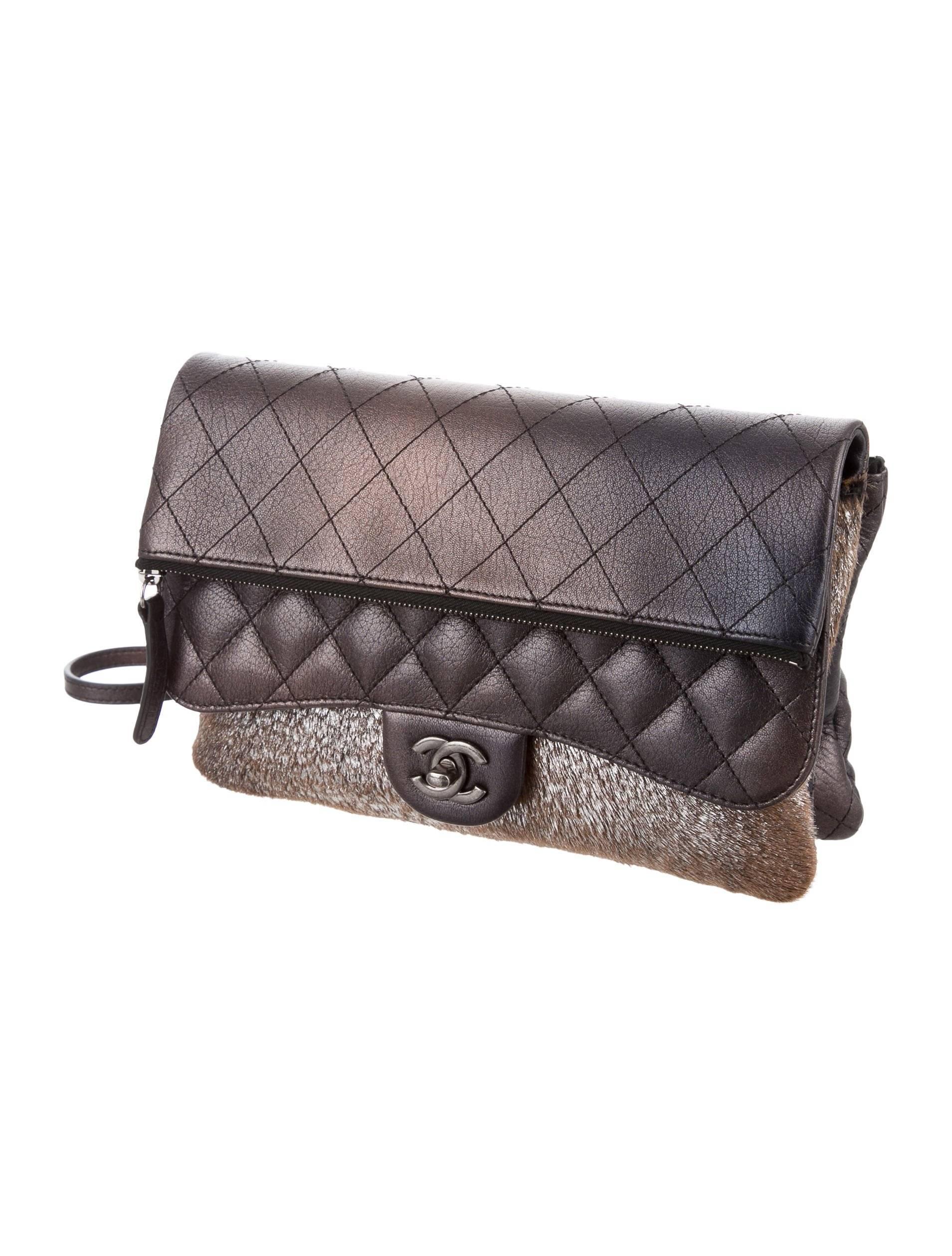 Chanel New Bronze Ombre Leather Envelope Pony Evening Shoulder Flap Bag

Leather
Ponyhair 
Silver tone hardware
Woven lining
Turn lock closure
Date code present
Made in Italy
Shoulder strap drop 21.5"
Measures 10" W x 6.5" H x