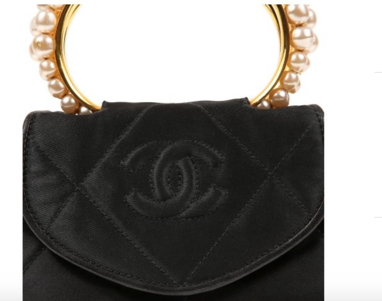 Chanel Black Small Three Pearl Kelly Style Pearl Top Handle Satchel Evening Flap Bag W/Box

Silk
Leather trim
Faux pearl
Leather lining
Made in Italy
Handle drop 2.5