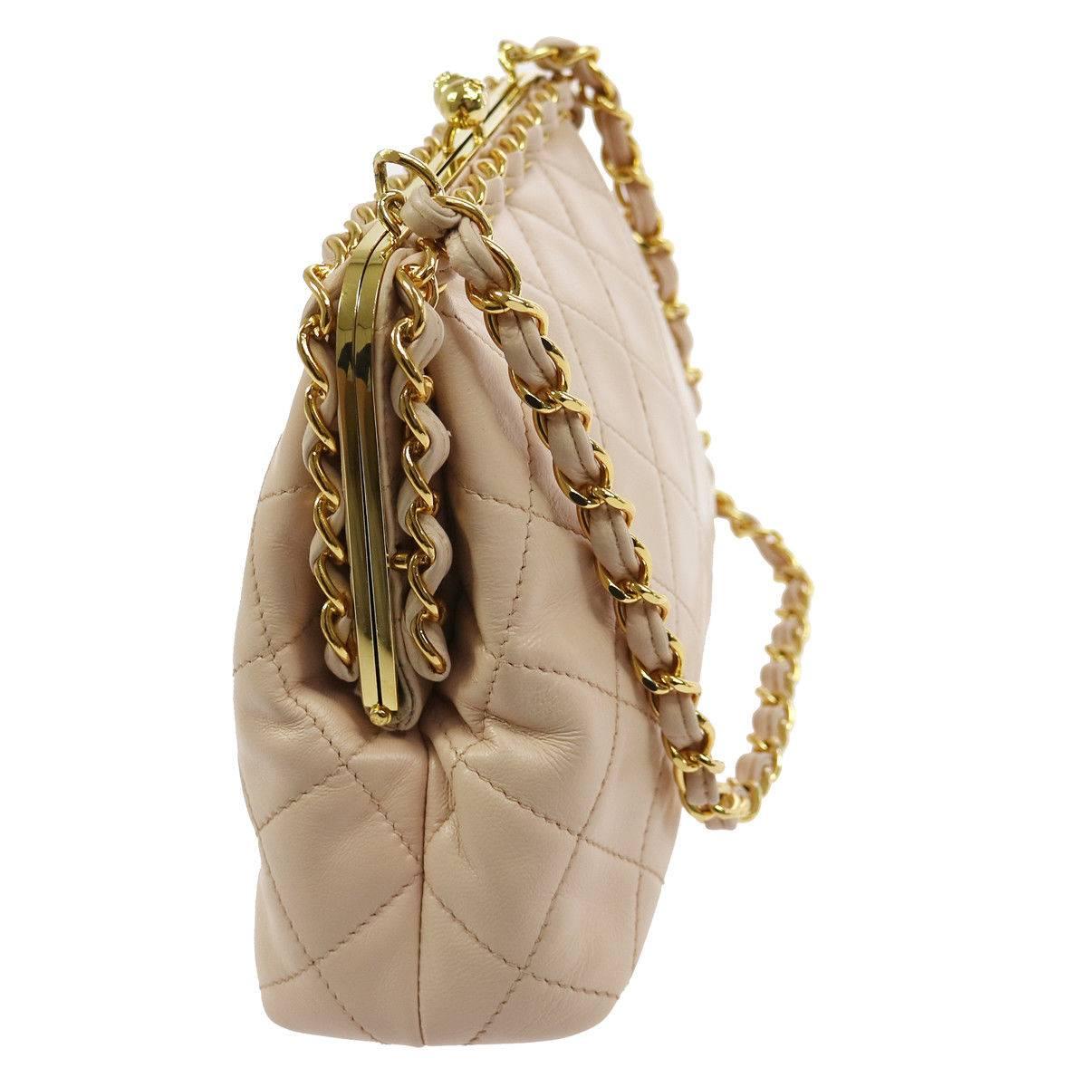 Chanel Nude Lambskin Wraparound KissLock Party Evening Top Handle Shoulder Bag

Lambskin leather
Gold tone hardware
Kisslock closure
Leather lining
Date code present
Made in Italy
Shoulder strap drop 8