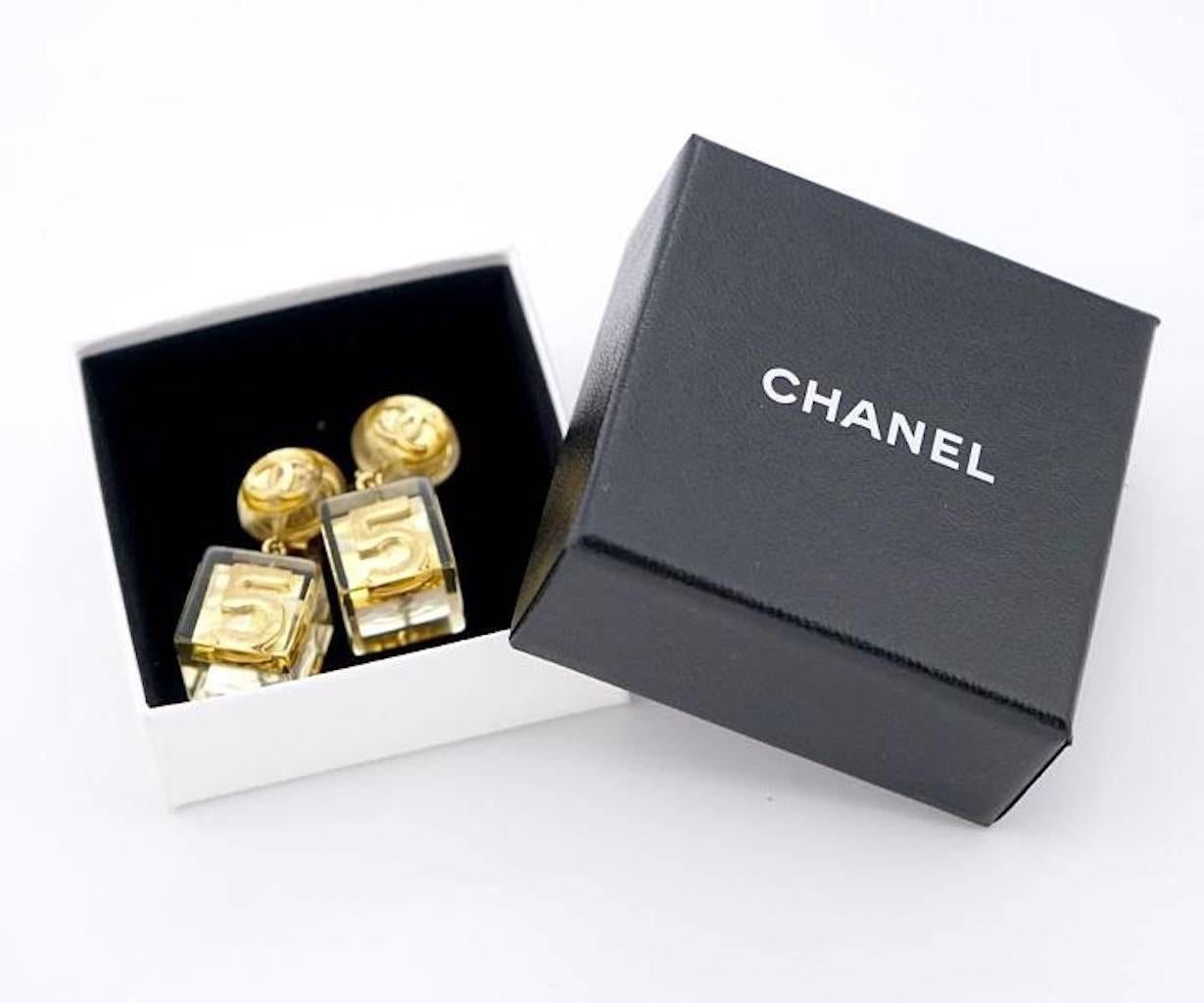 Chanel RARE No. 5 Gold CC Clear Lucite Cube Dangle Drop Earrings in Box

Resin
Gold tone
Clip on closure
Made in France
Drop 1.5