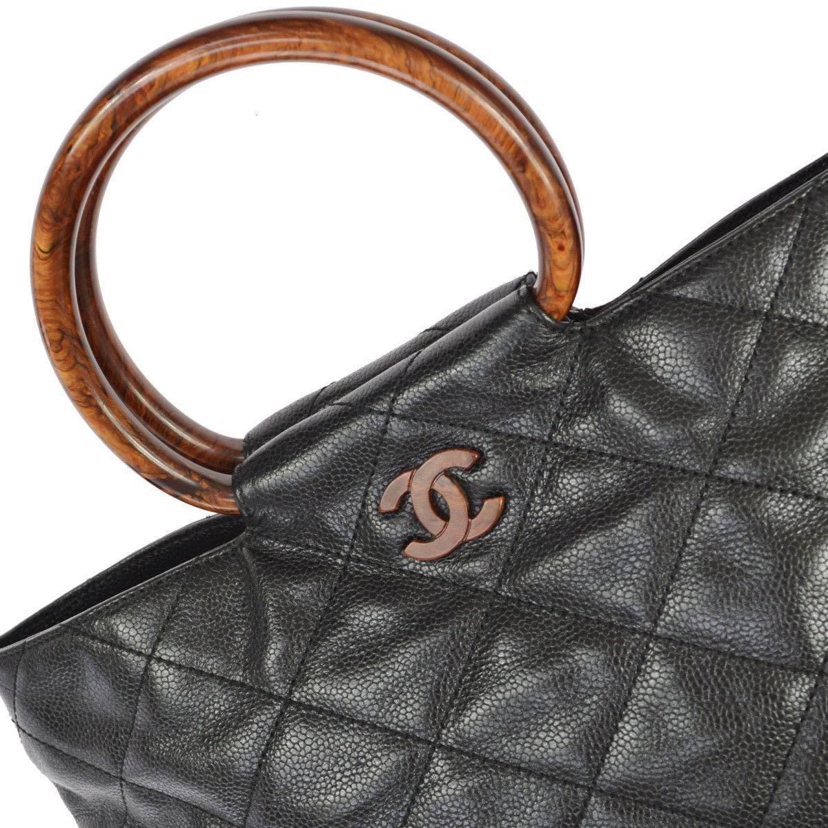 Chanel Black Leather Cross Stitch Kelly Style Brown Tortoise Top Handle Satchel Bag

Leather
Leather lining
Date code present
Made in Italy
Handle drop 4