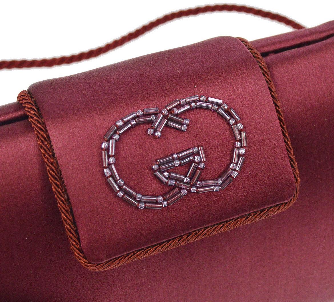 Gucci Burgundy Wine 2 in 1 Evening Shoulder Box Flap Clutch Bag in Box

Satin
Bead
Made in Italy
Shoulder strap drop 19.5