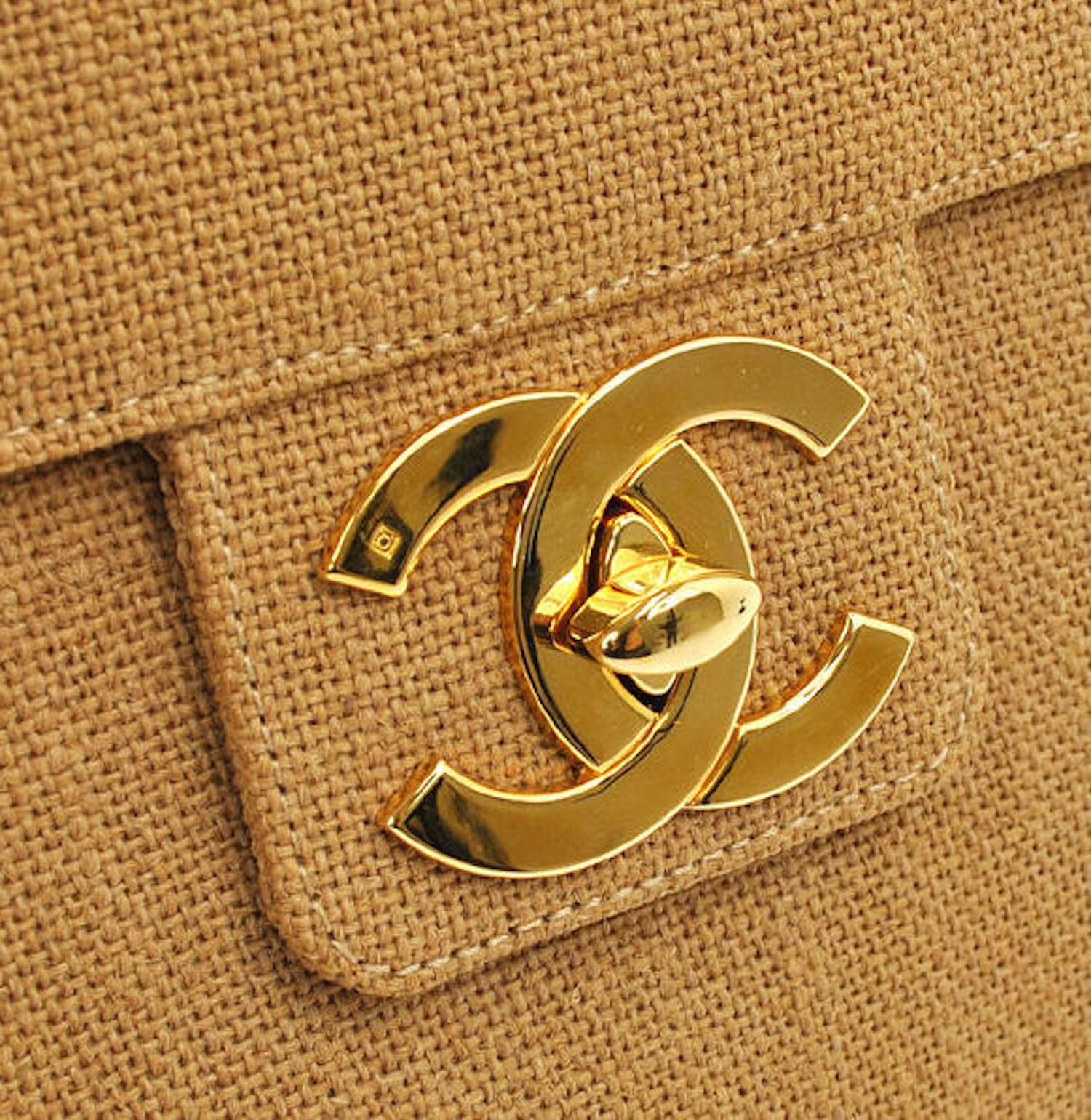 Chanel Vintage Cognac Tan Canvas Men's Women's Large Charm Top Handle Business Flap Bag

Canvas
Gold tone hardware
Leather lining
Date code present
Made in France
Handle drop 2