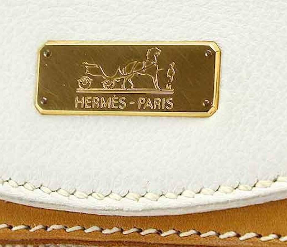 Hermes Tan Canvas Cognac Leather Men's Women's Top Handle Satchel Carryall Shoulder Bag

Canvas
Leather
Leather lining
Gold tone hardware 
Made in France
Date code present
Handle drop 10