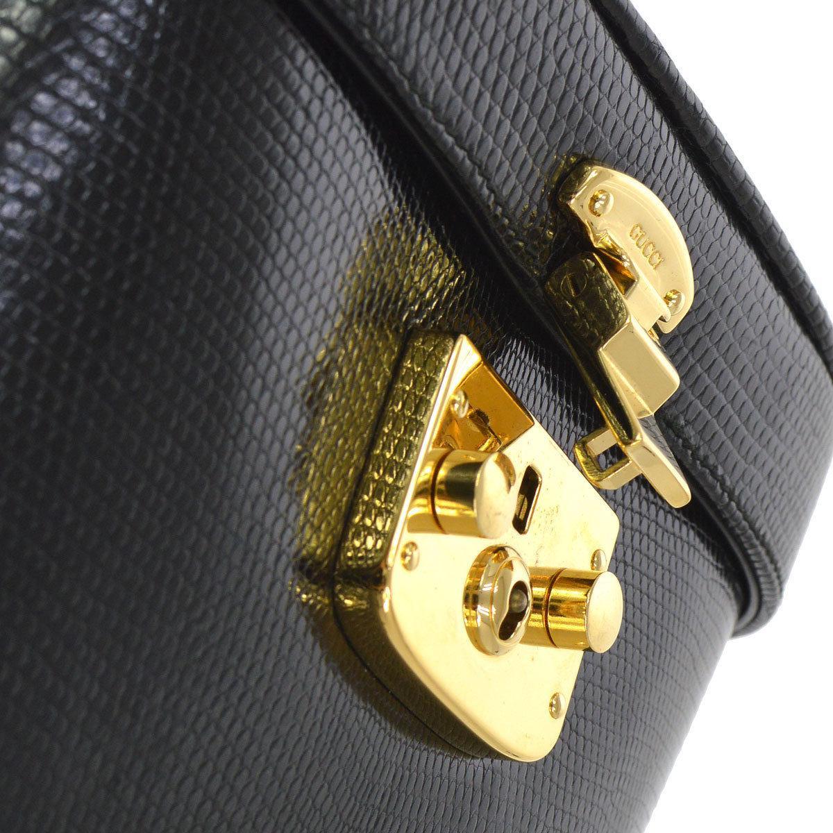 Gucci Black Lizard Leather Top Handle Satchel Vanity Style Mini Small Bag

Lizard
Gold tone hardware
Key lock closure
Leather lining
Made in Italy
Handle drop 4.25