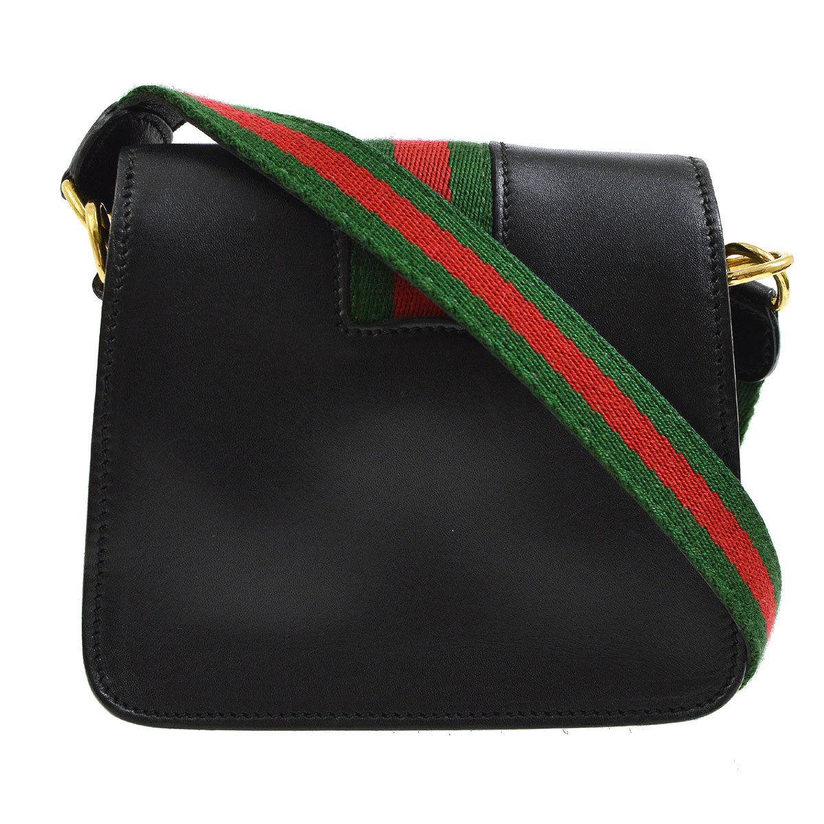 black gucci crossbody with red and green strap