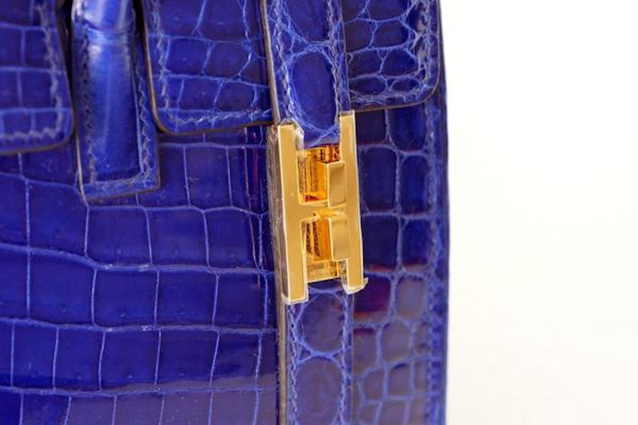 Hermes Rare Blue Crocodile Gold 'H' Drag Buckle Evening Top Handle Satchel Flap Bag

Niloticus Crocodile 
Gold plated hardware
Leather lining
Flip-lock closure
Date code present
Made in France
Handle drop 3.5