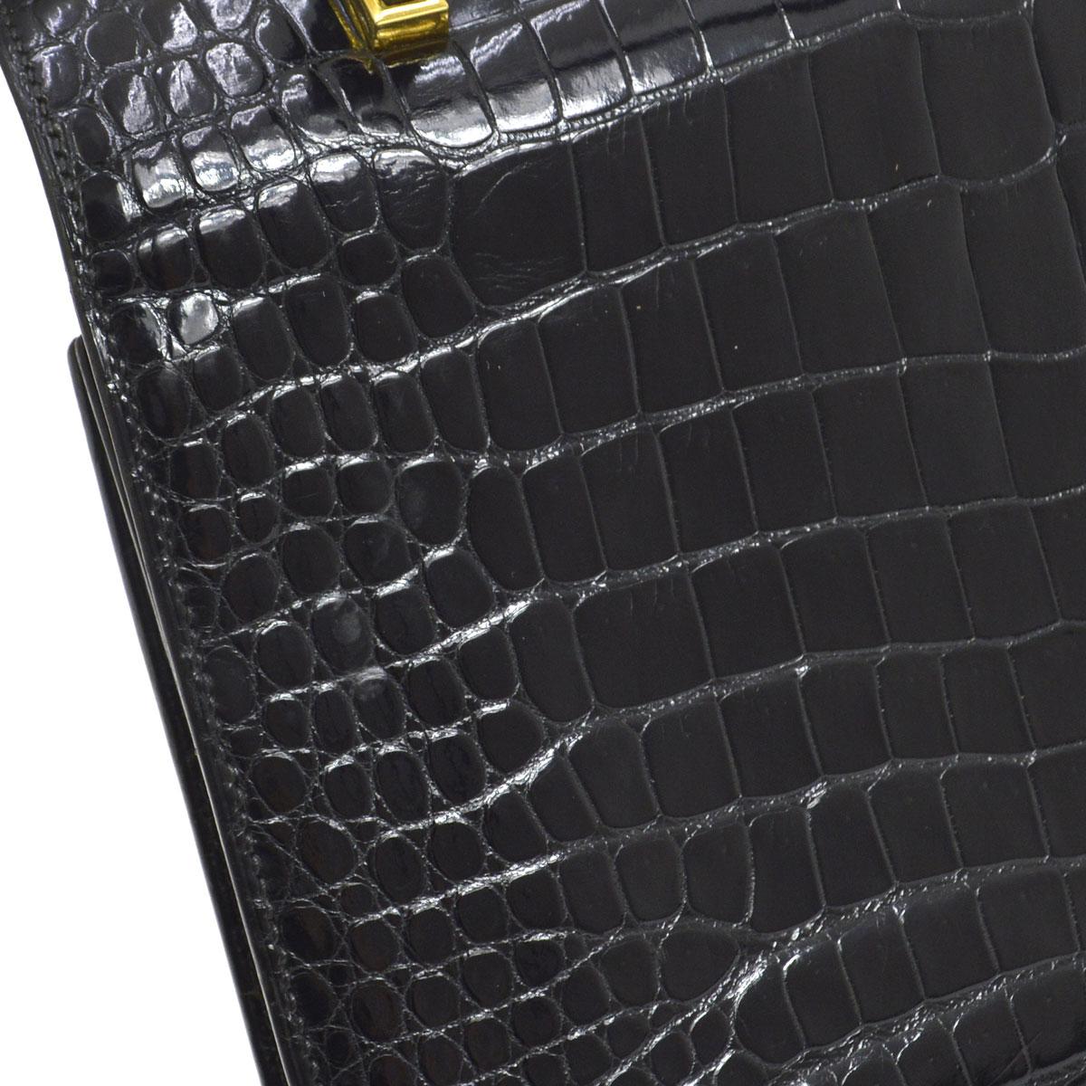 Hermes Rare Black Leather Gold Emblem Evening Kelly Style Top Handle Satchel Bag

Crocodile leather
Gold tone hardware
Leather lining
Made in France
Handle drop 4.5