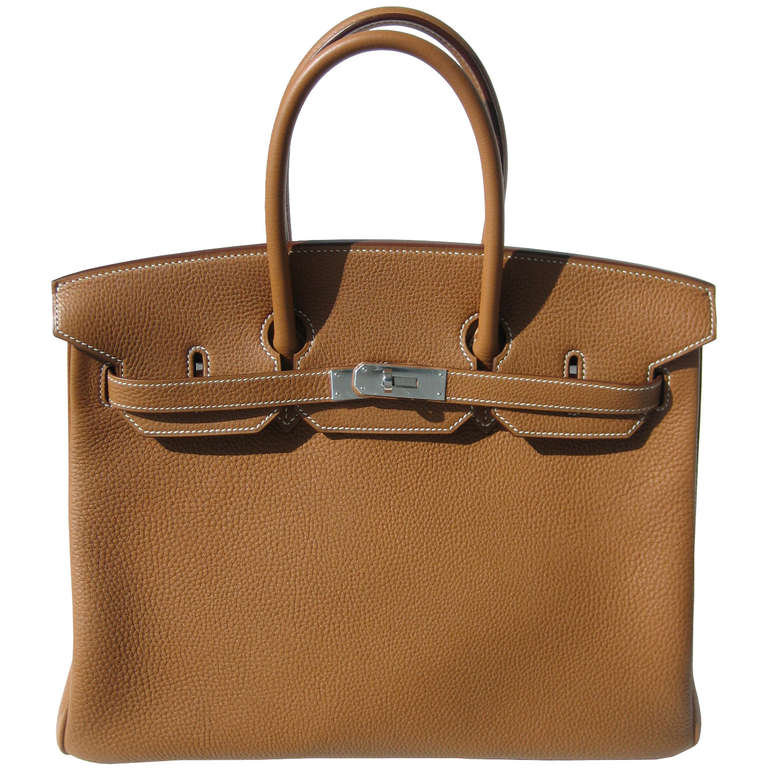 Beautiful Handbag

Brand New

35cm Hermes Gold Togo Leather Birkin Handbag | White Stitching | Palladium Hardware | Q Stamp

The bag measures 35cm / 14