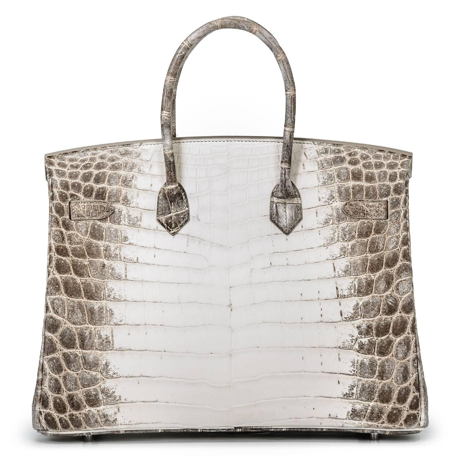 This 35 cm Himalayan Birkin crafted from the skin of an almost-albino pale crocodile to give it a white Himalaya color. The  Himalayan Birkin is the rarest and most desirable handbag in the world!!!

It is sold only to Hermès VIP clients with a