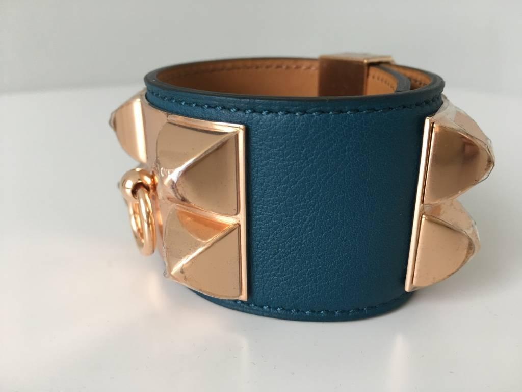 Rare Rose Gold Hardware!
Limited!

CDC bracelet made of colvert swift leather and beautifully accentuated with rose gold hardware. The bracelet is BNIB with protective plastic seals still present and comes with original packaging.

Size small, fits